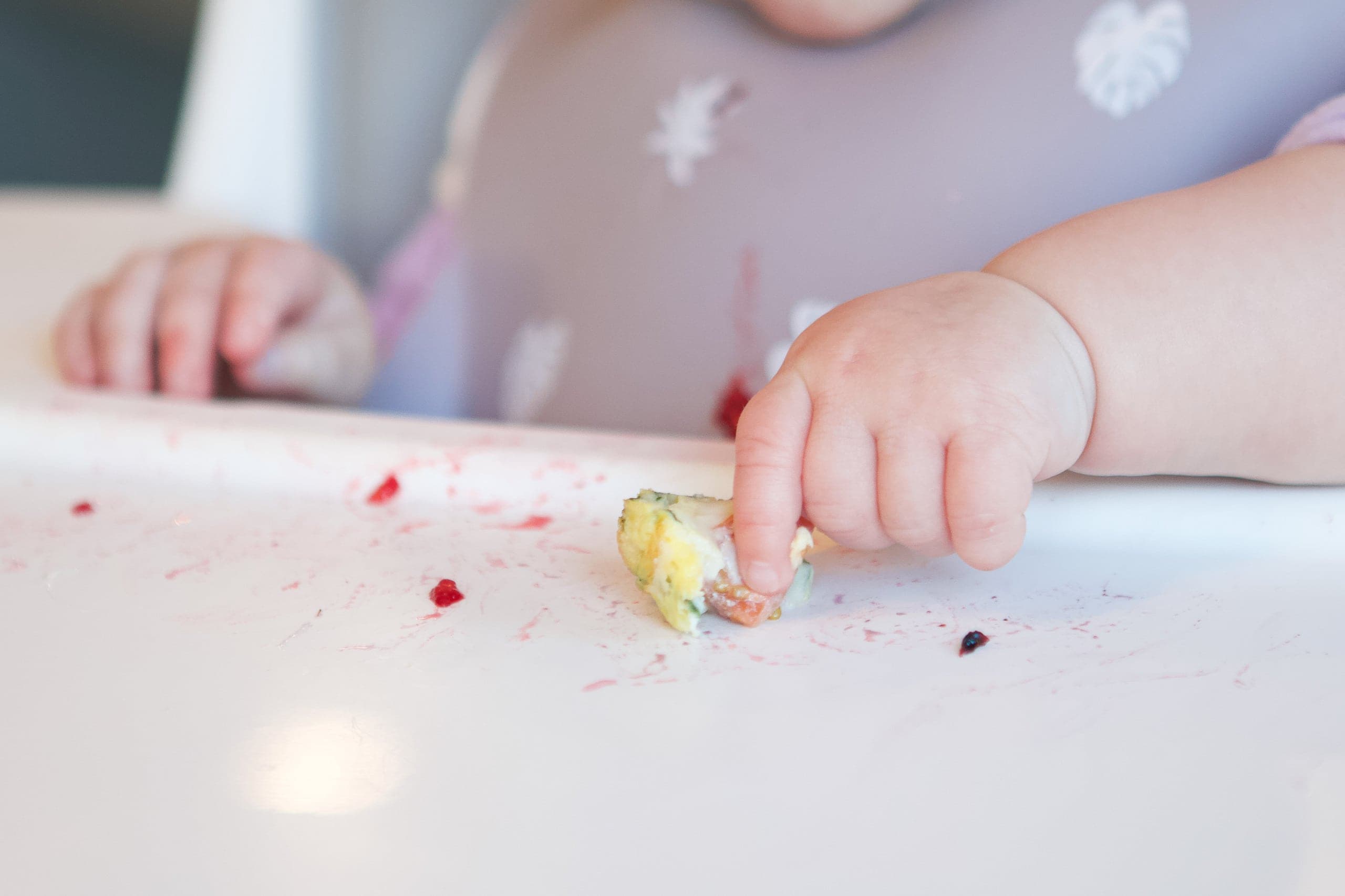 Rory doing baby led weaning and using her pincer grasp