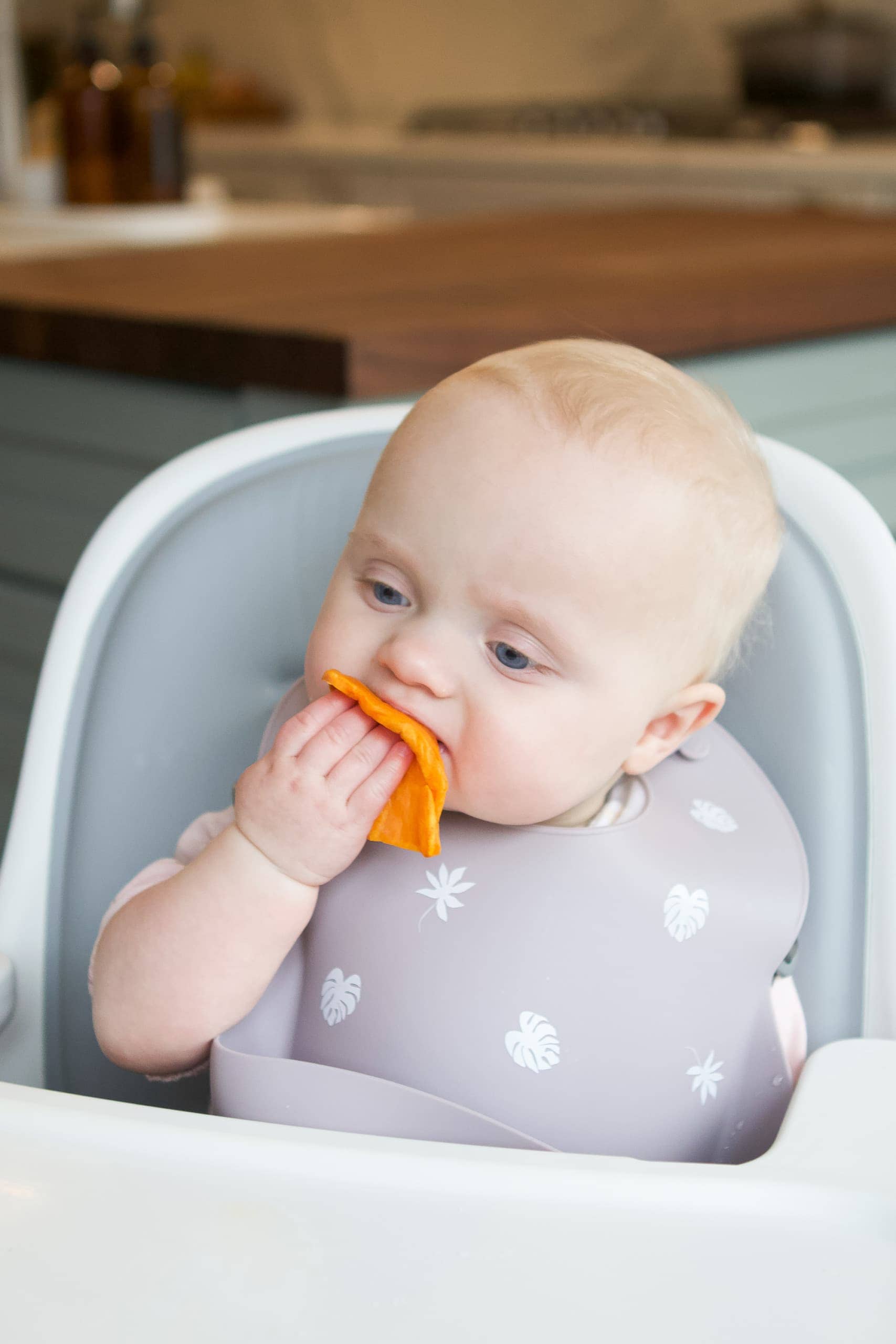 Rory doing baby led weaning to eat sweet potatoes