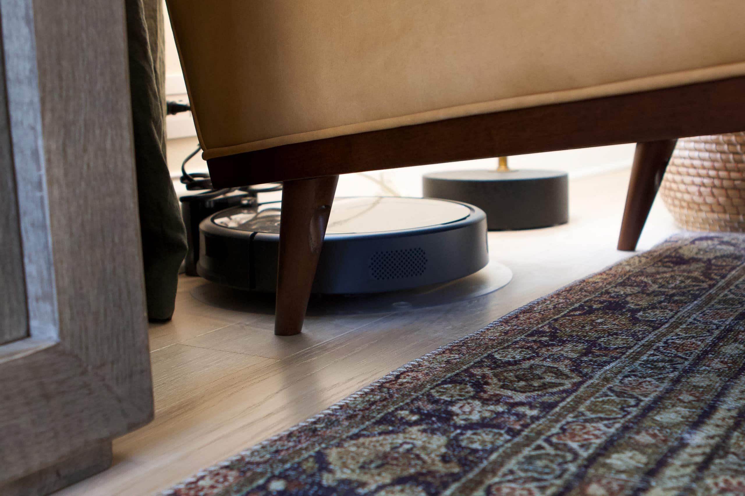 A view of our robot vacuum under our chair