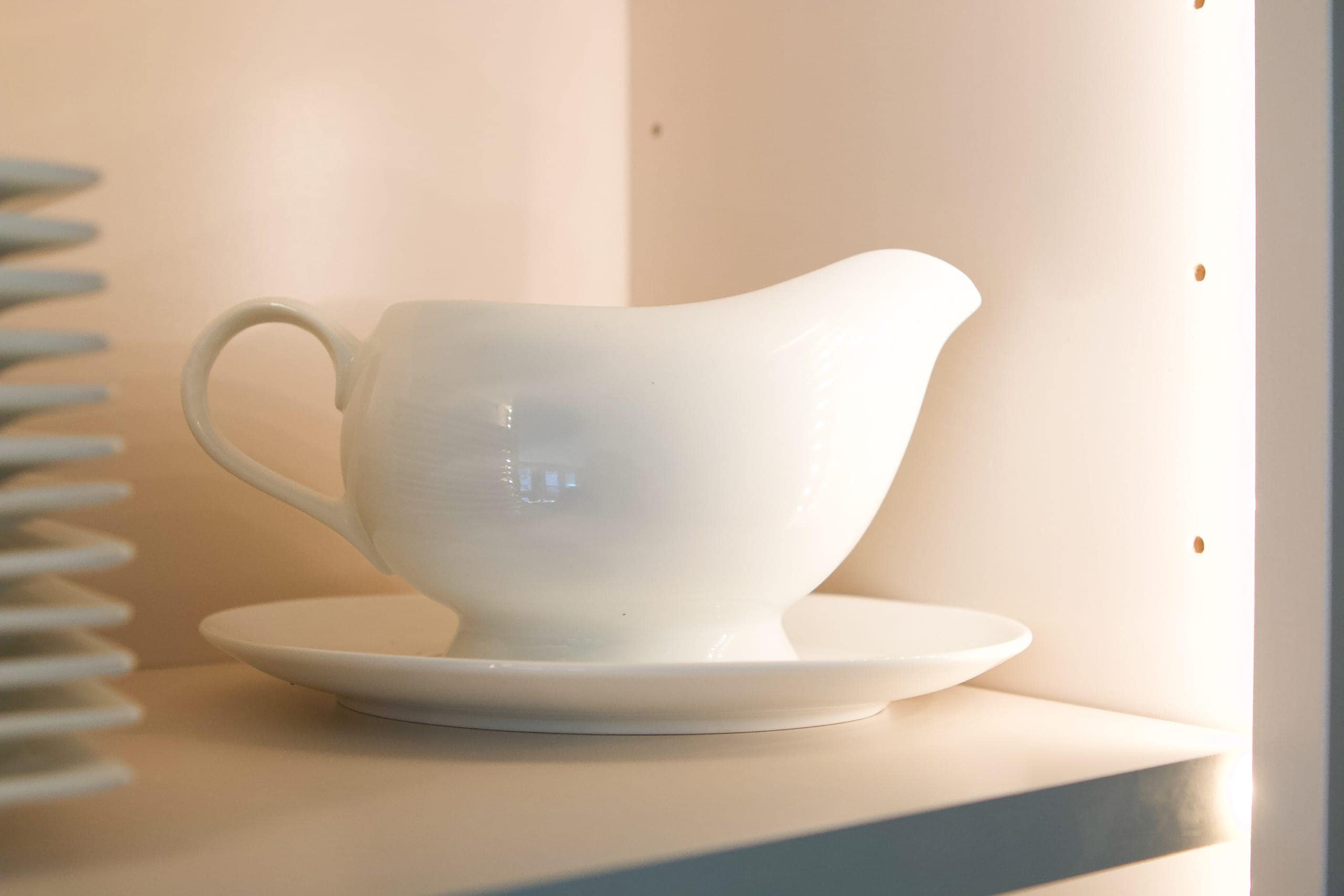 Gravy boat in a kitchen cabinet