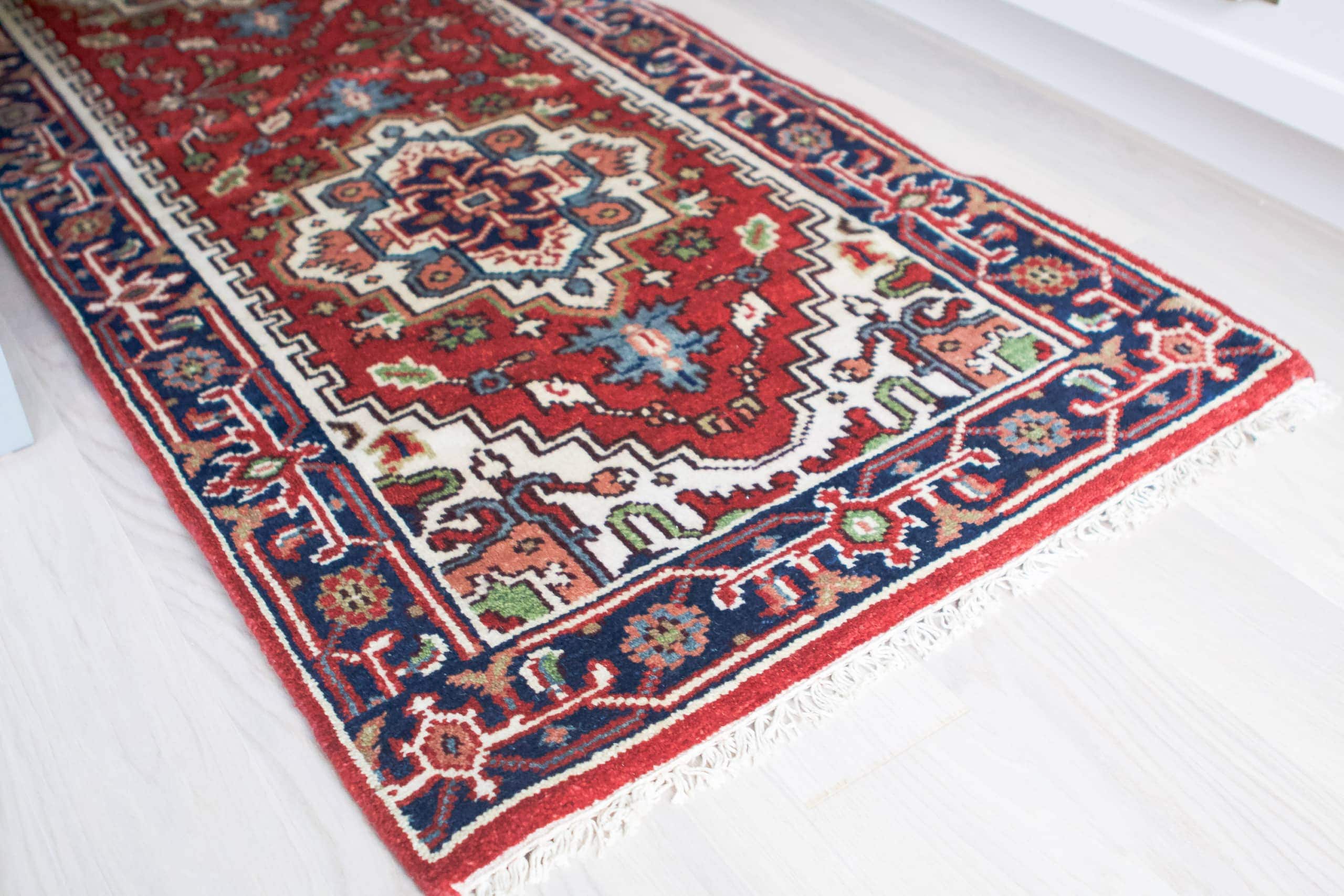 A colorful rug in the kitchen