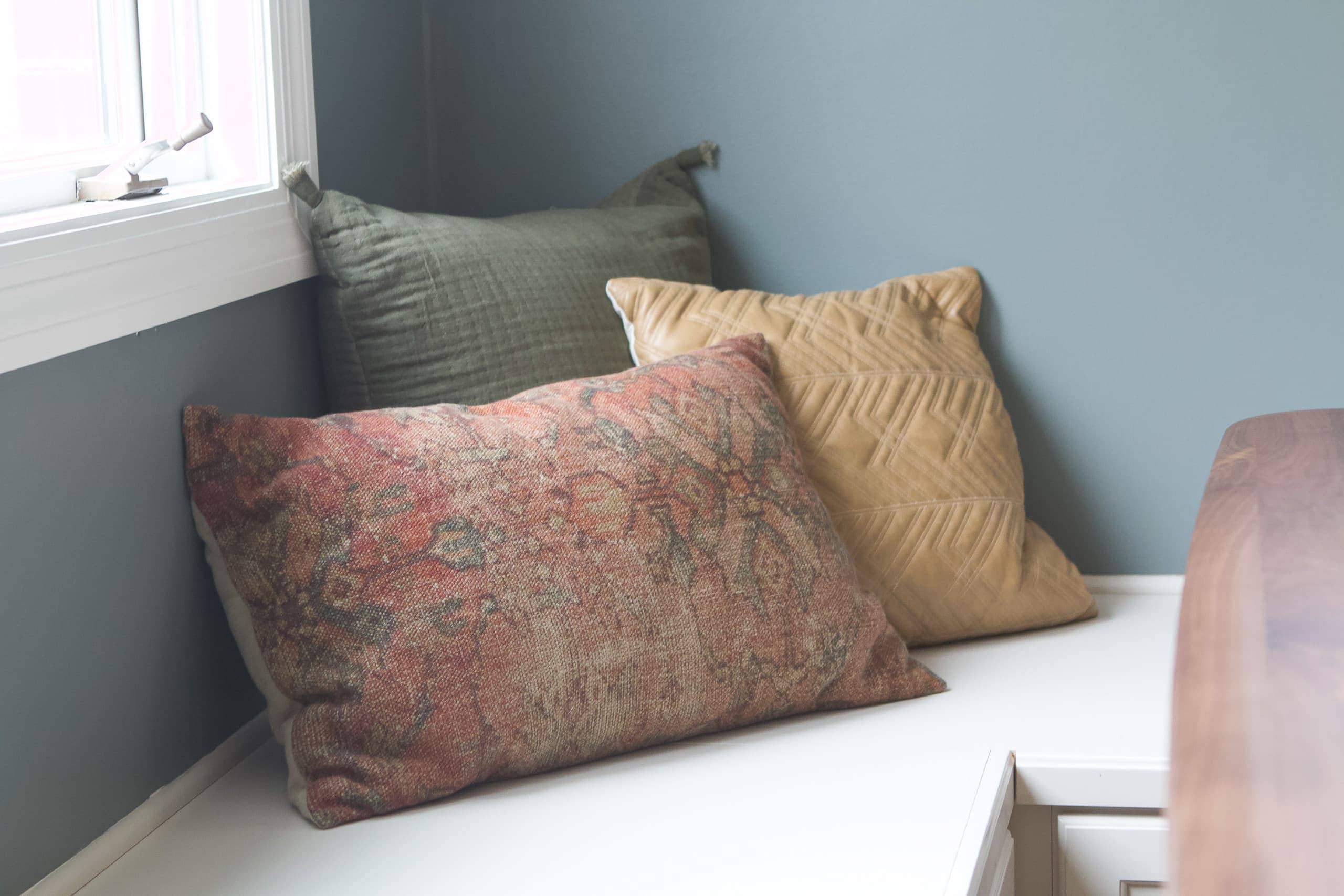 Pillows on a dining bench