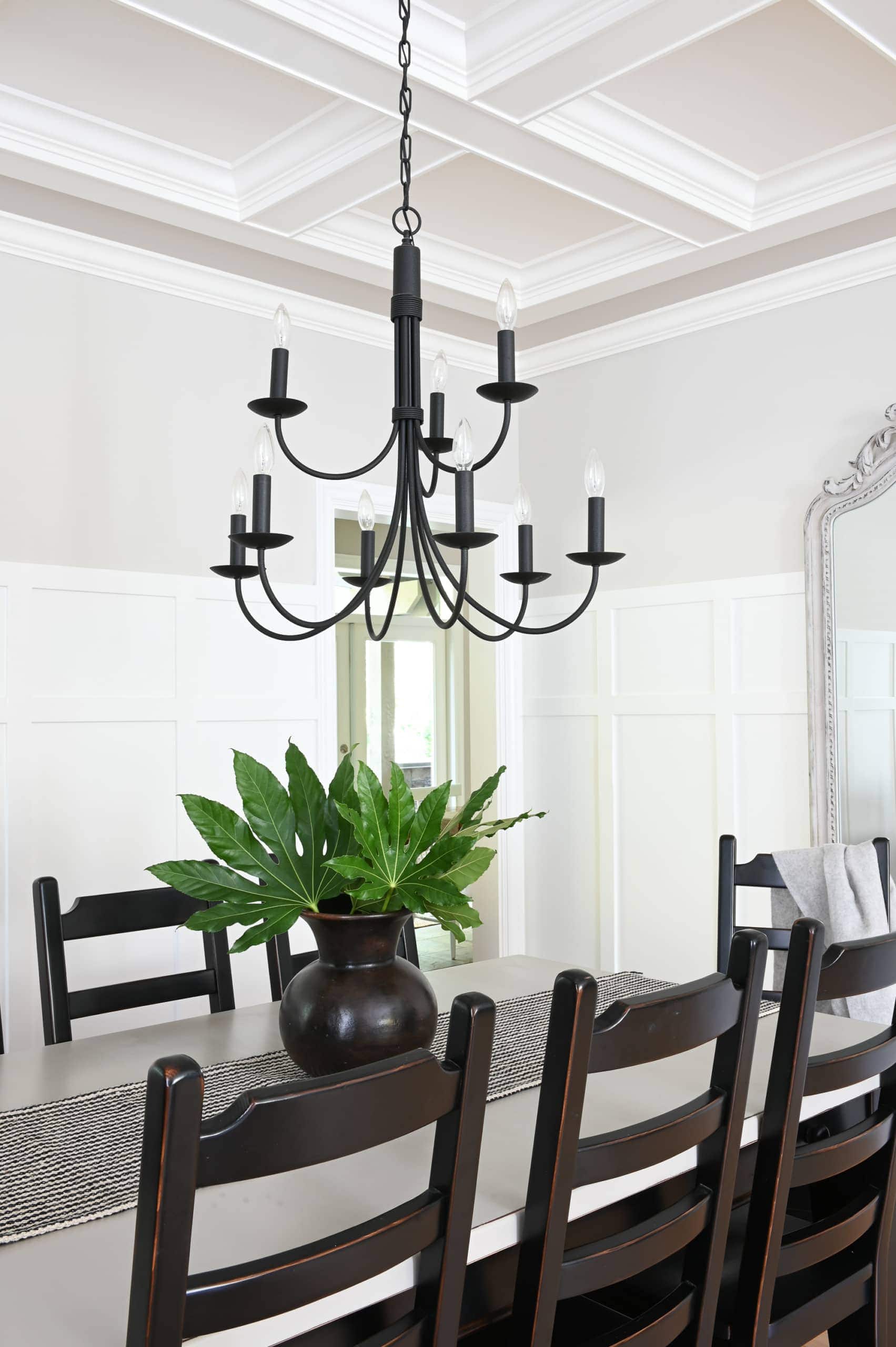 black chandelier over a dining room table