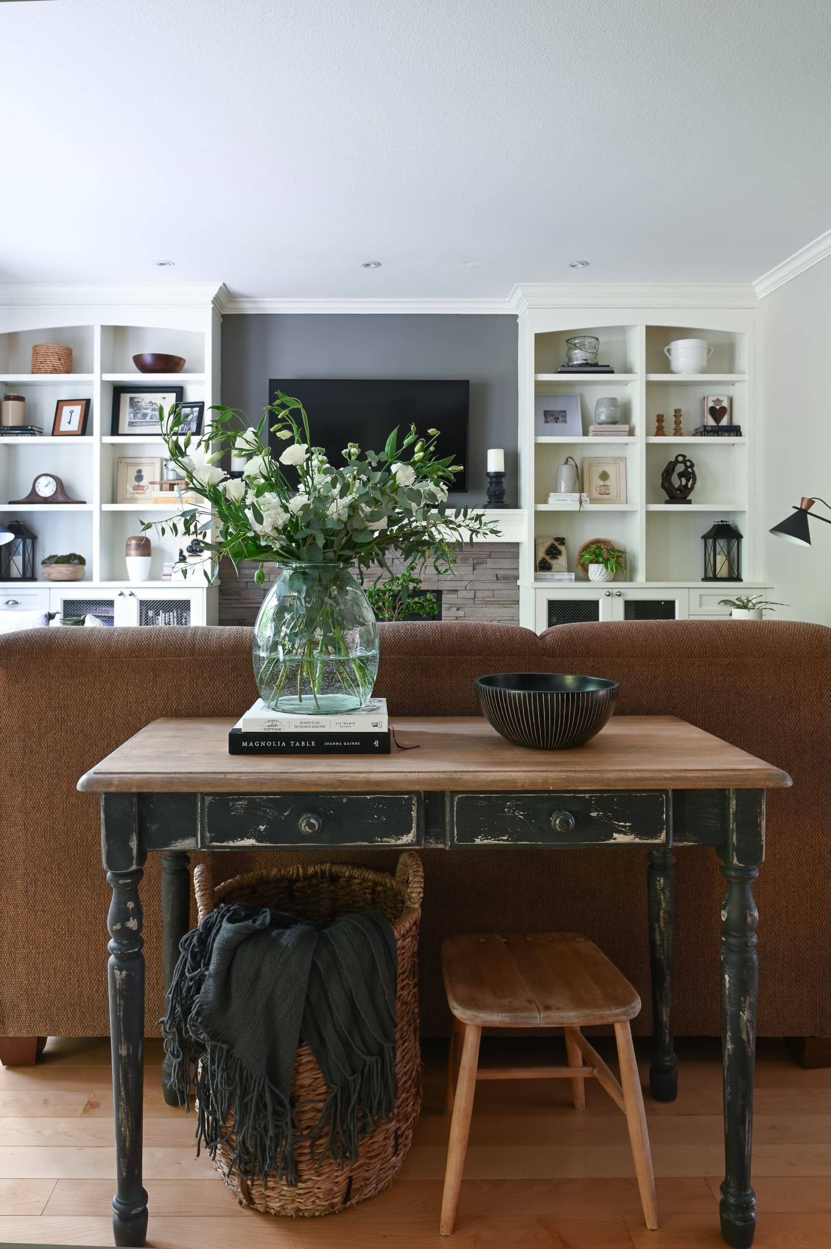 Farmhouse style console table behind a couch