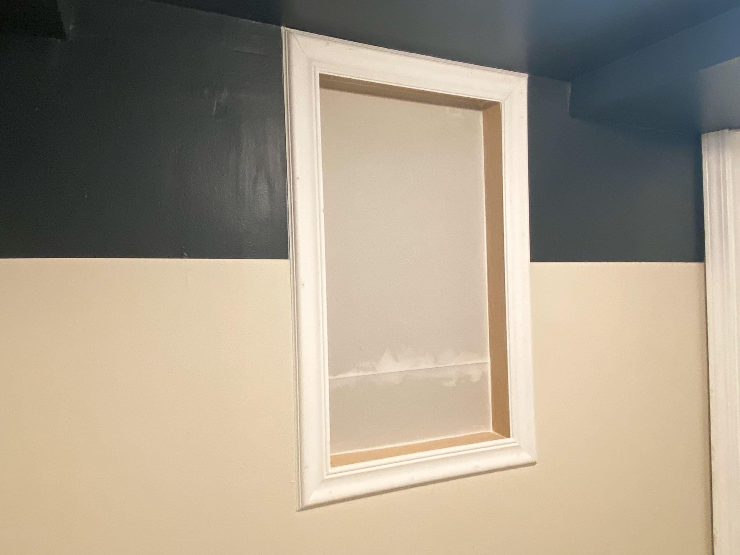 Adding trim to our basement window shelves