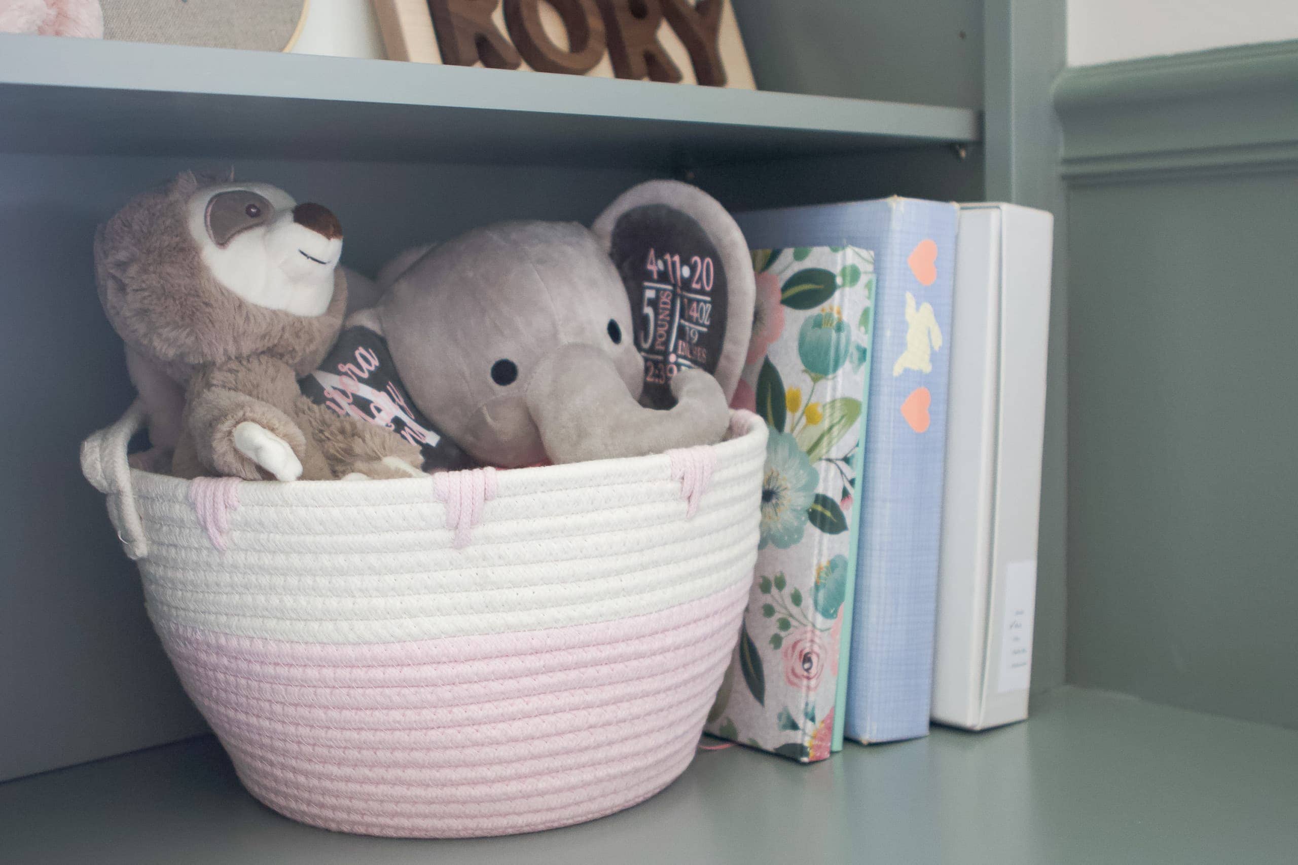 Use baskets to corral items on nursery shelves