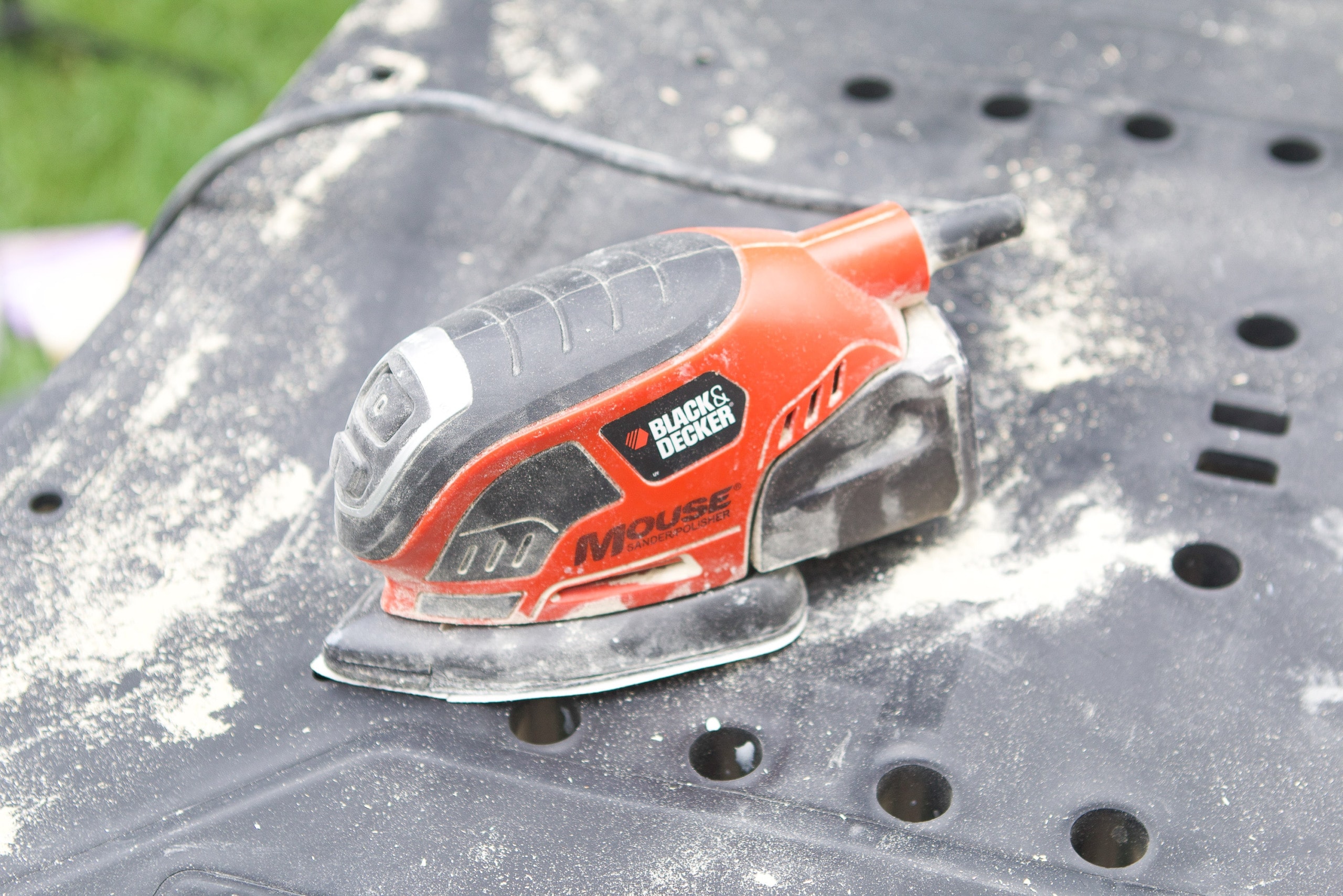 use a palm sander to prep the wood shelves