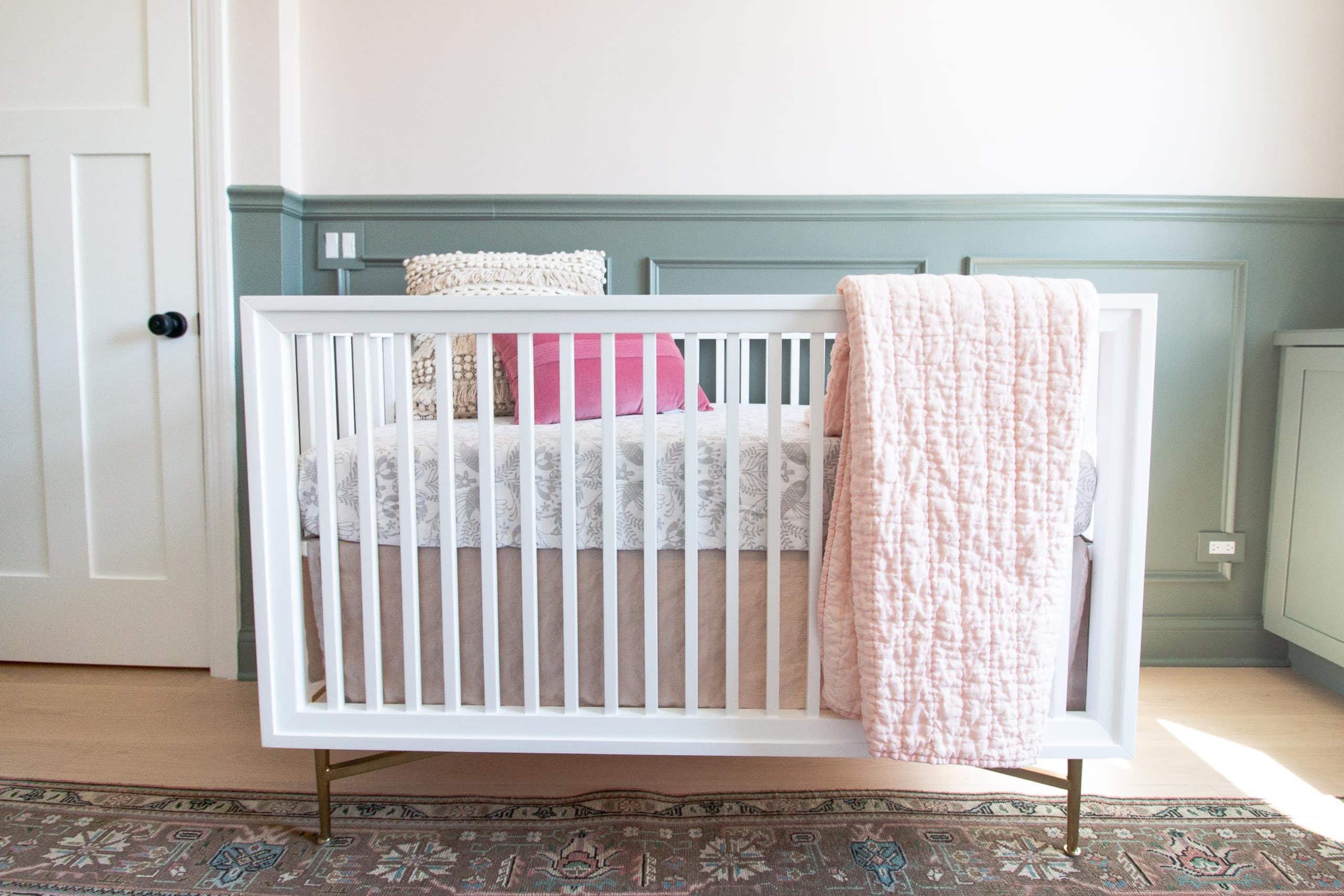 White and brass crib from Crate and Kids