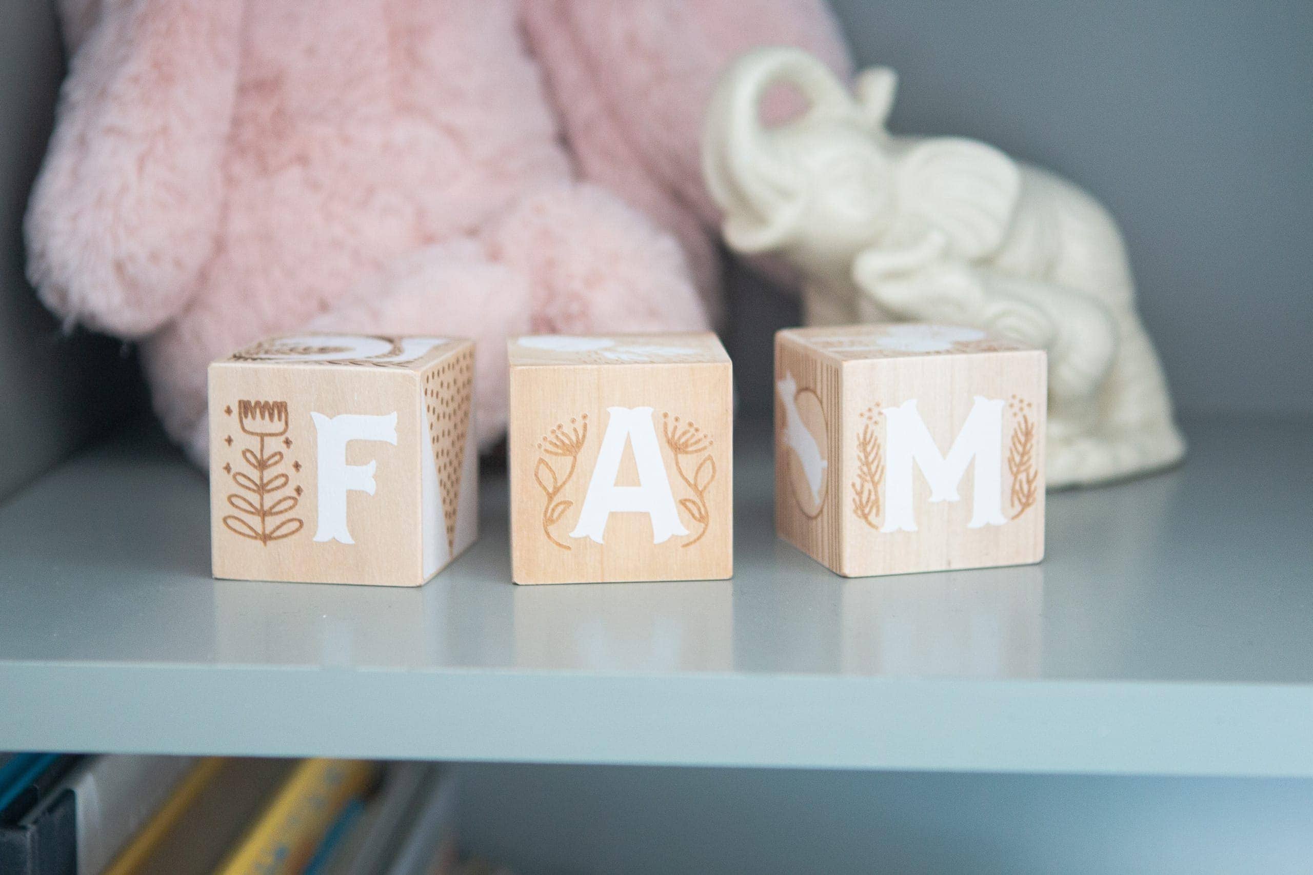 Wooden blocks as decor in a baby girl's nursery