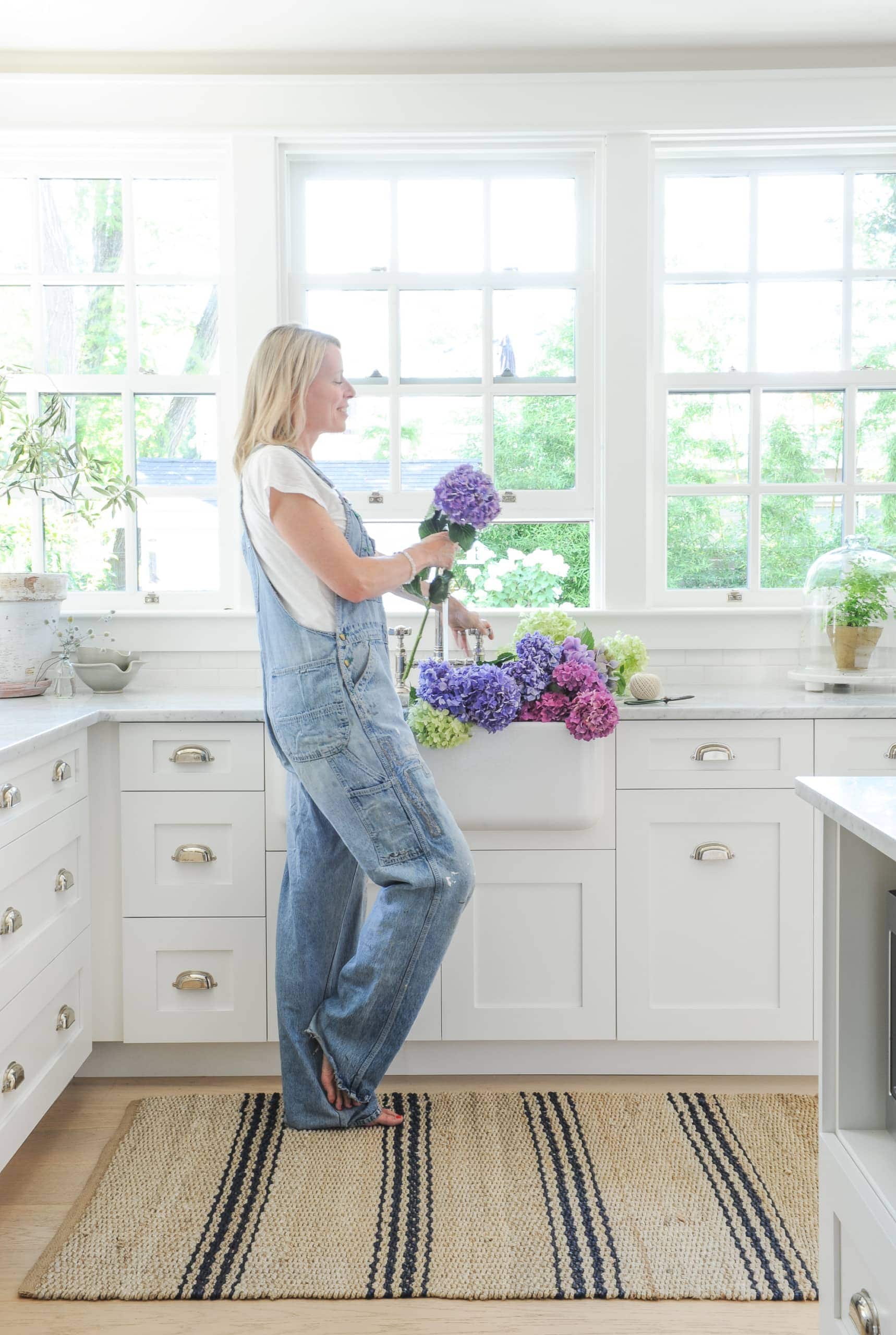 Tracey with flowers in the kitchen