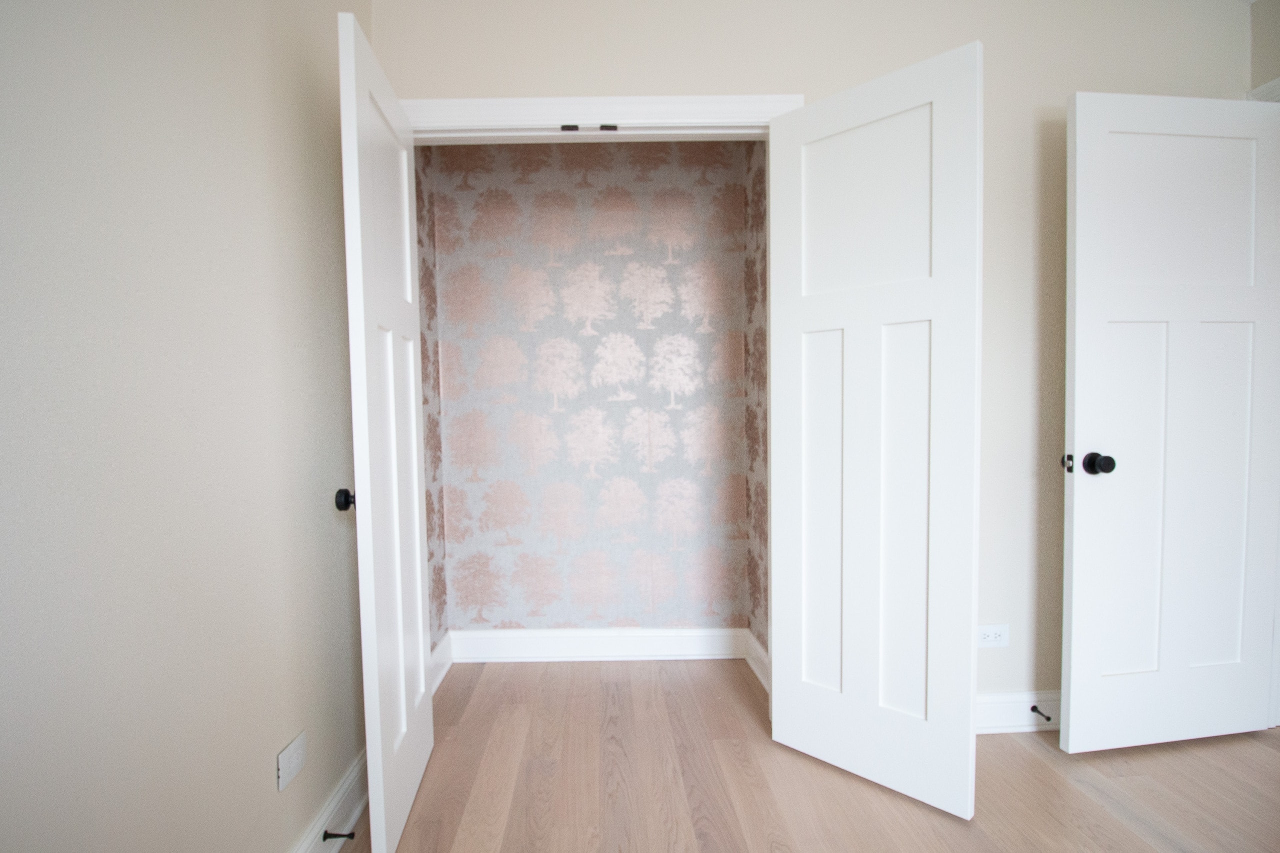 Wallpapered closet after