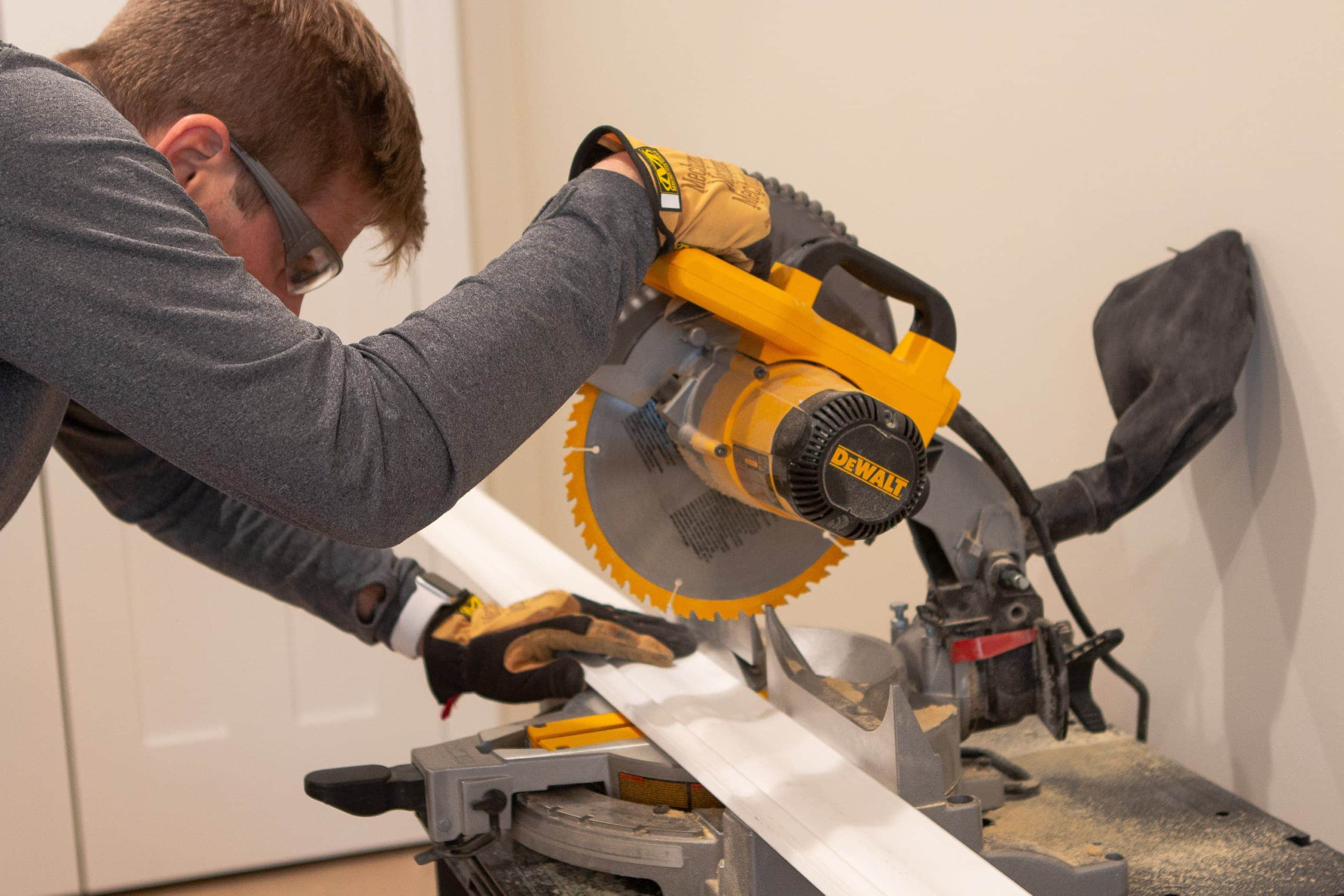 using a miter saw to cut crown molding