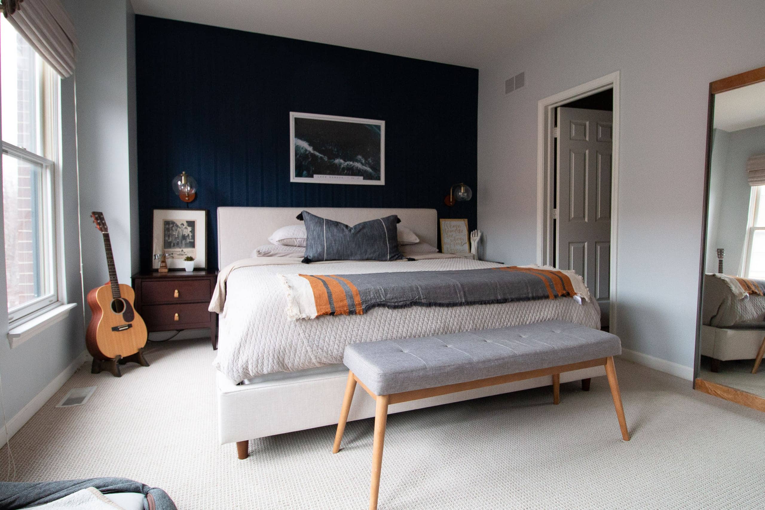 Master bedroom with navy accent wall