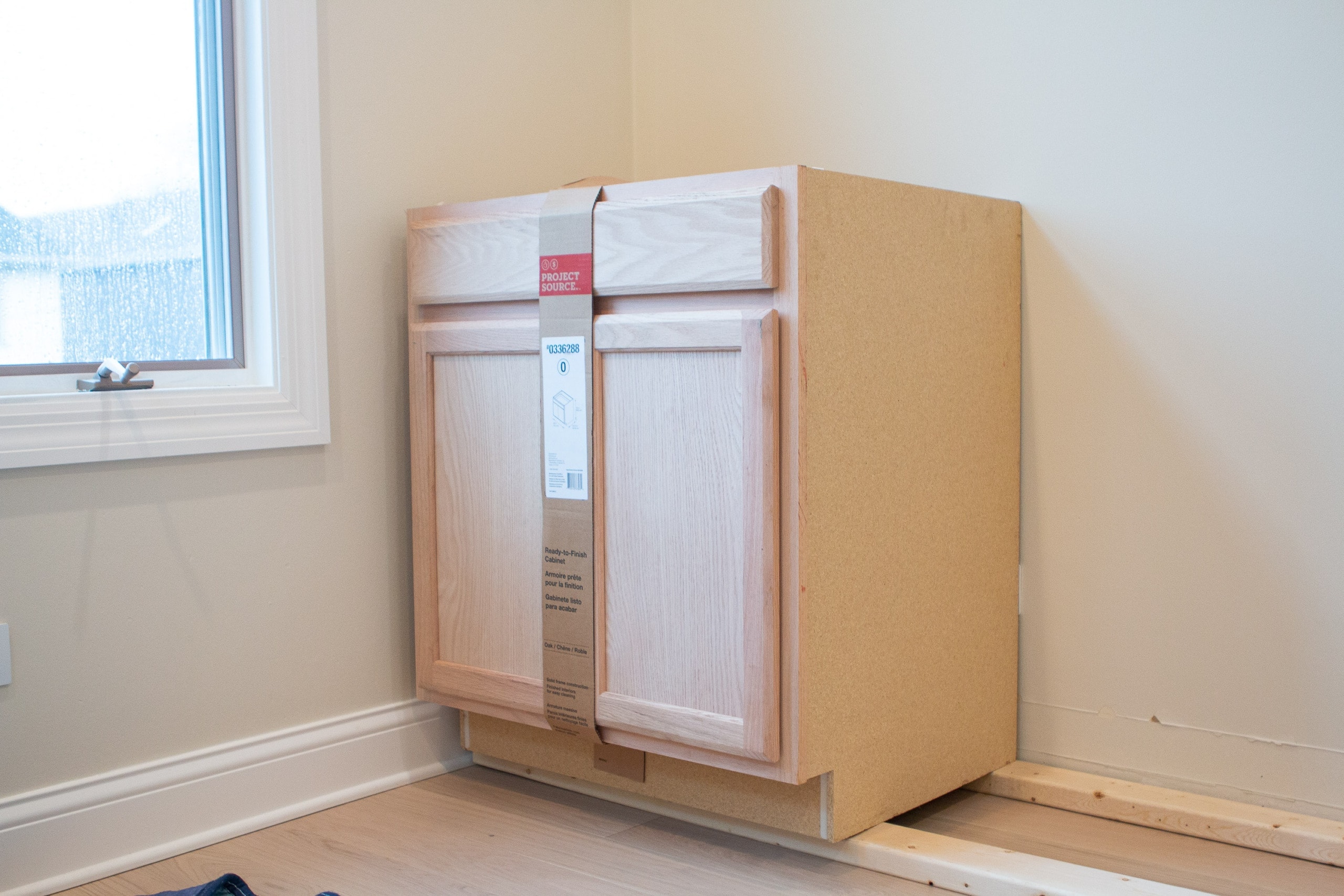 Propping the cabinets up on wood frame