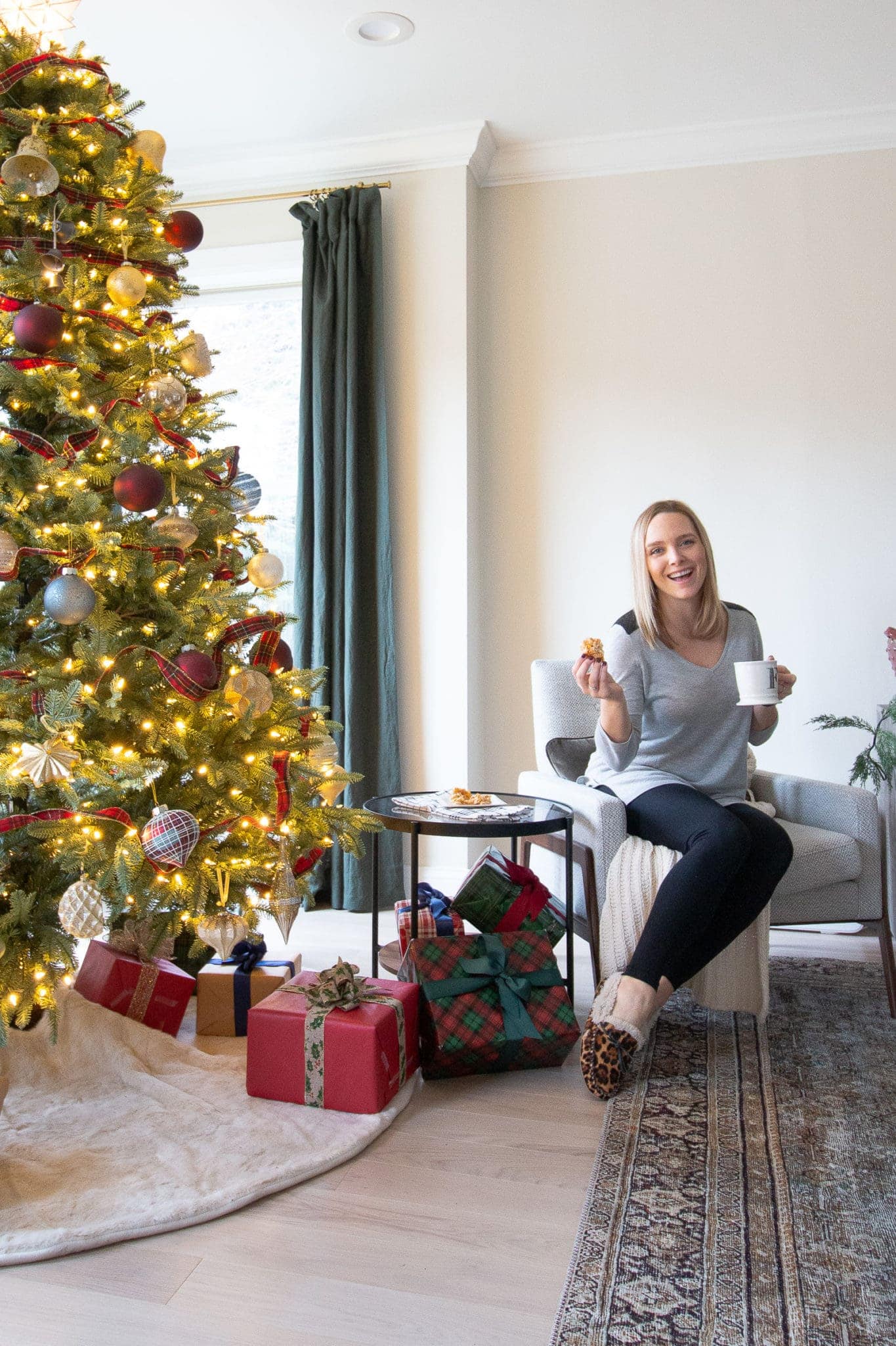 Casey enjoying coconut crispies by the christmas tree