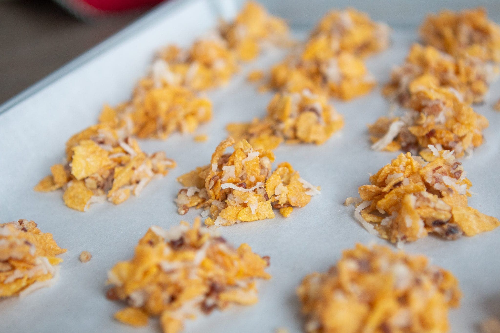 Form small bowls before baking coconut crispies