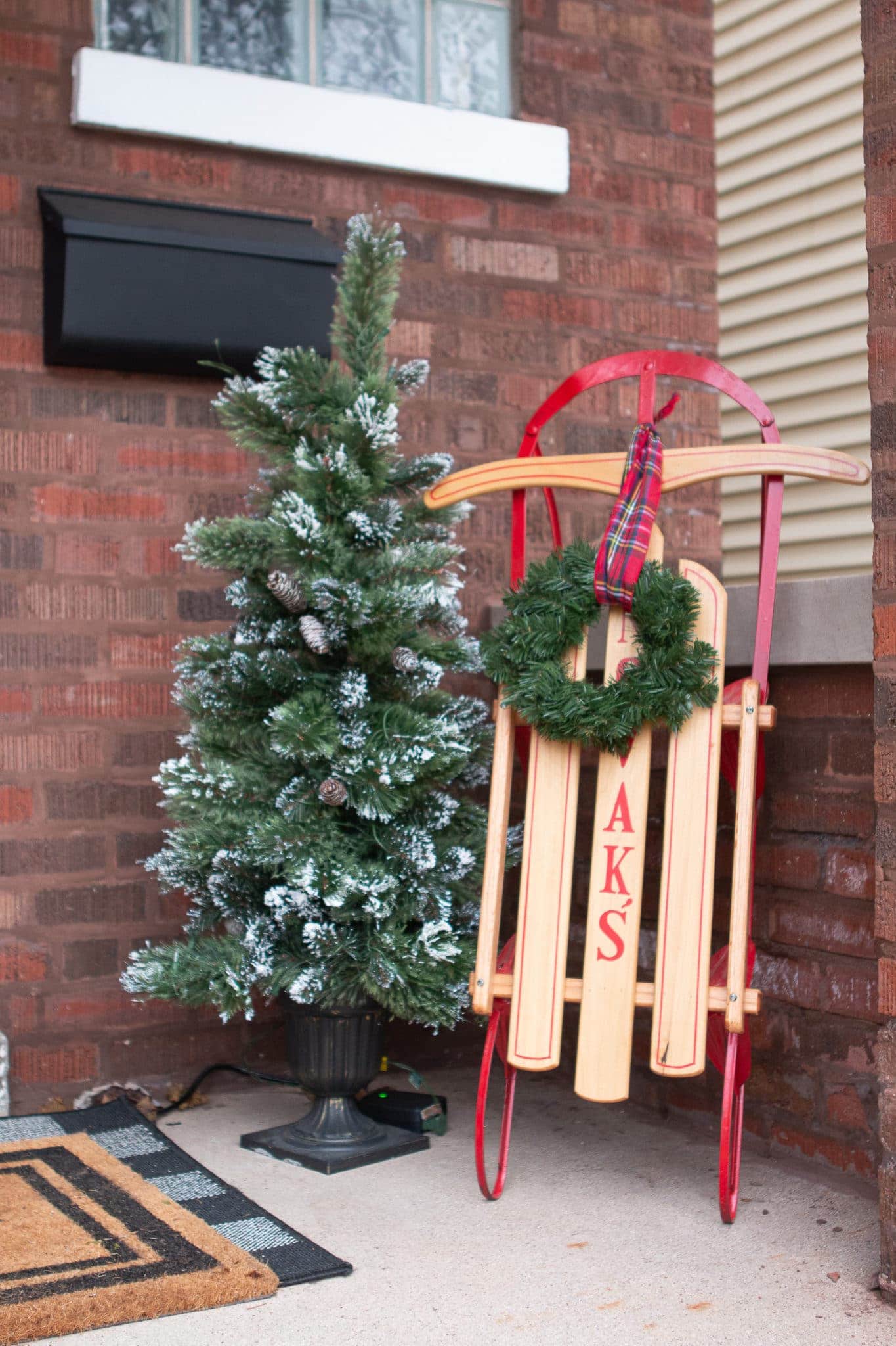 Sleigh and tree on the front porch for my 2019 christmas home tour