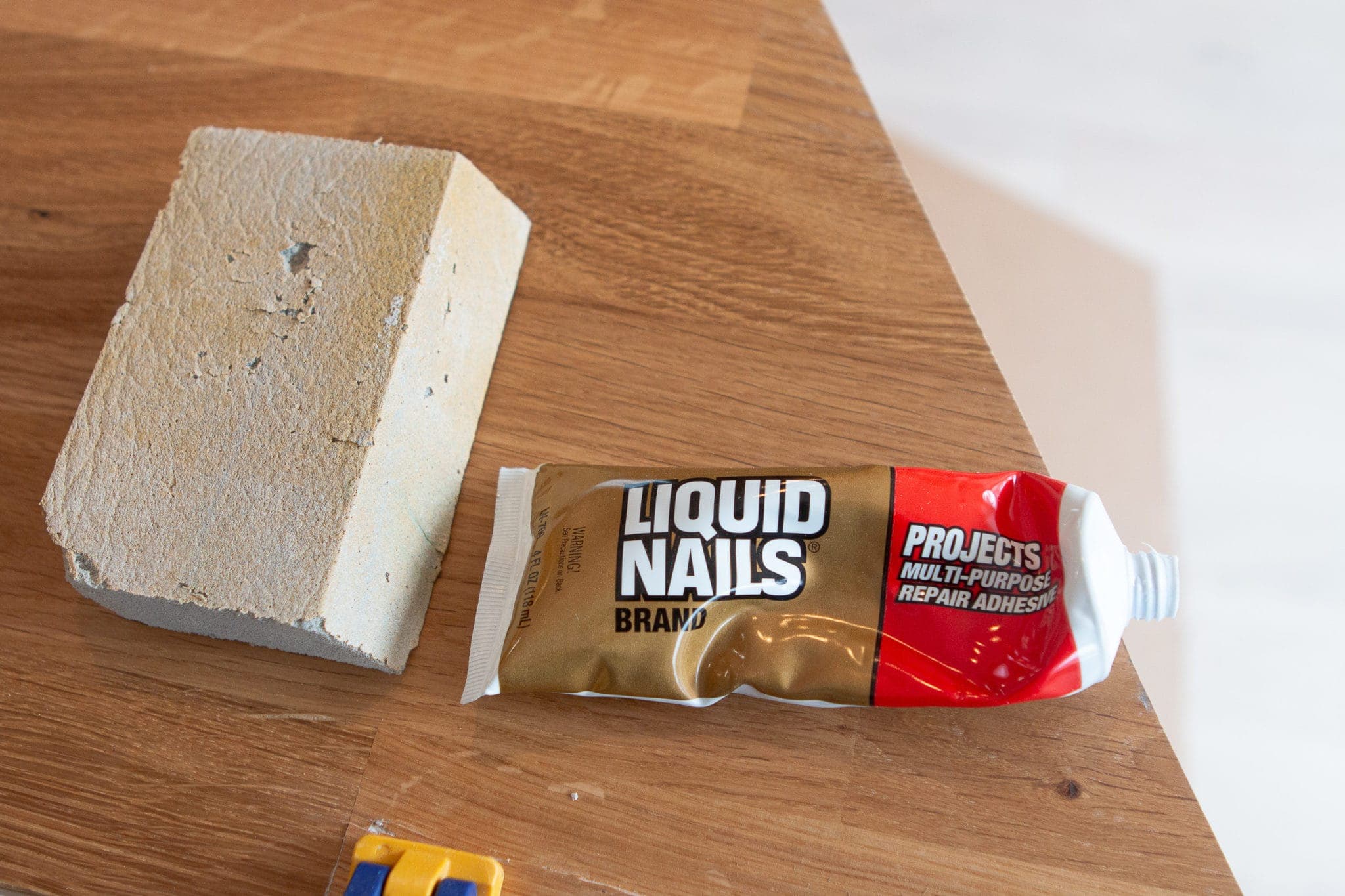 Using liquid nails and a sanding block