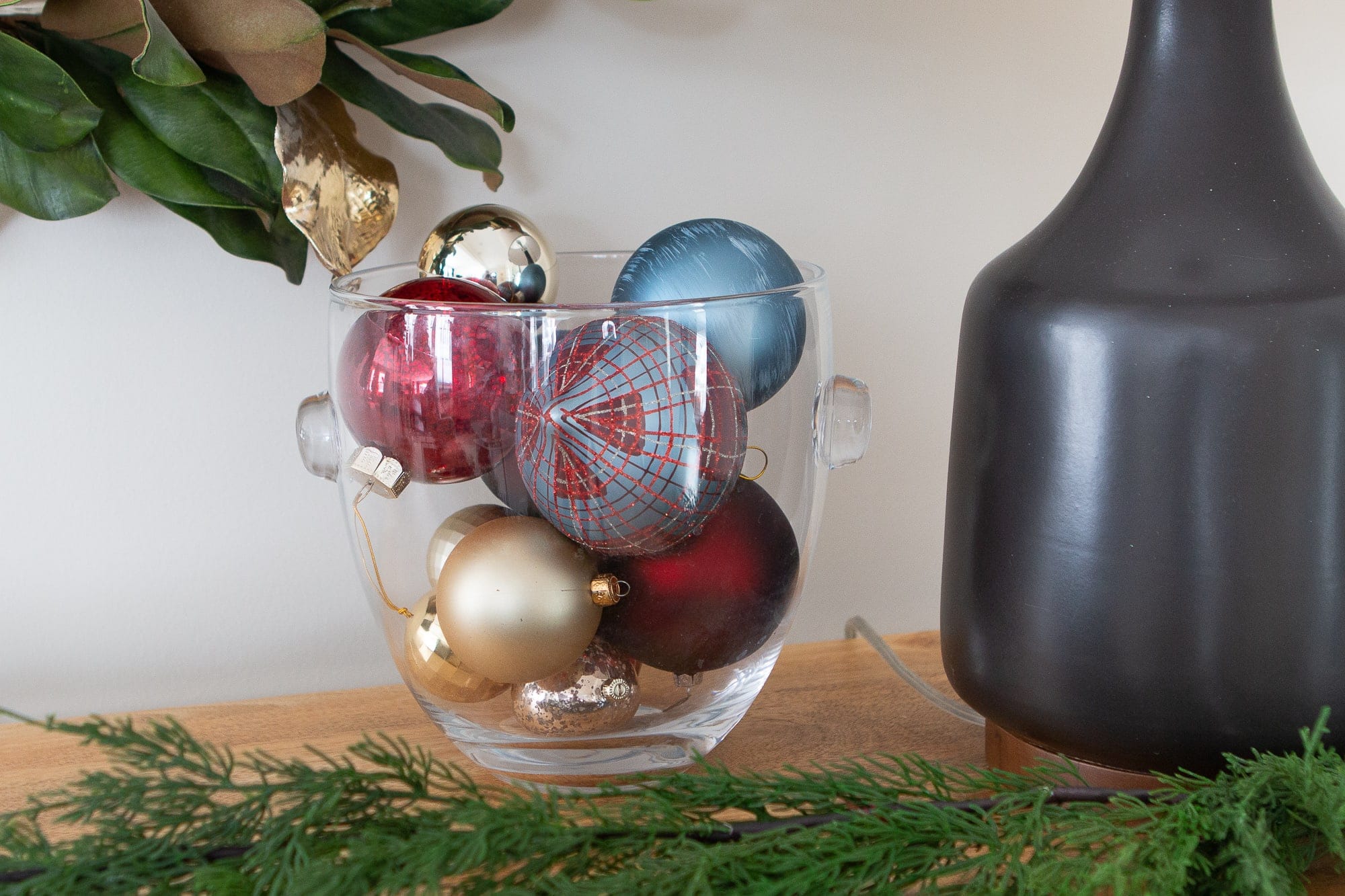 Fill a bowl with ornaments in your holiday entry