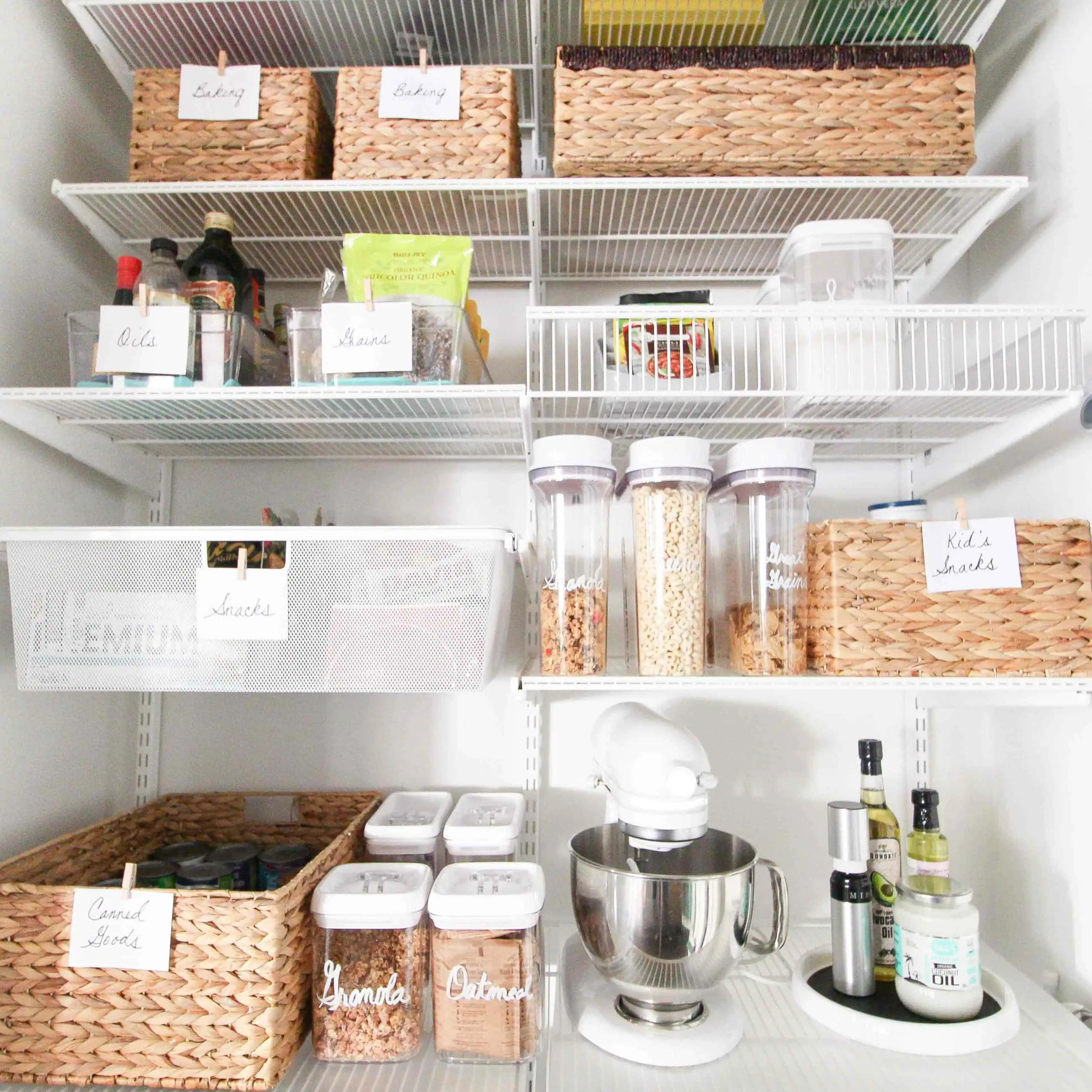 An organized pantry with wicker baskets