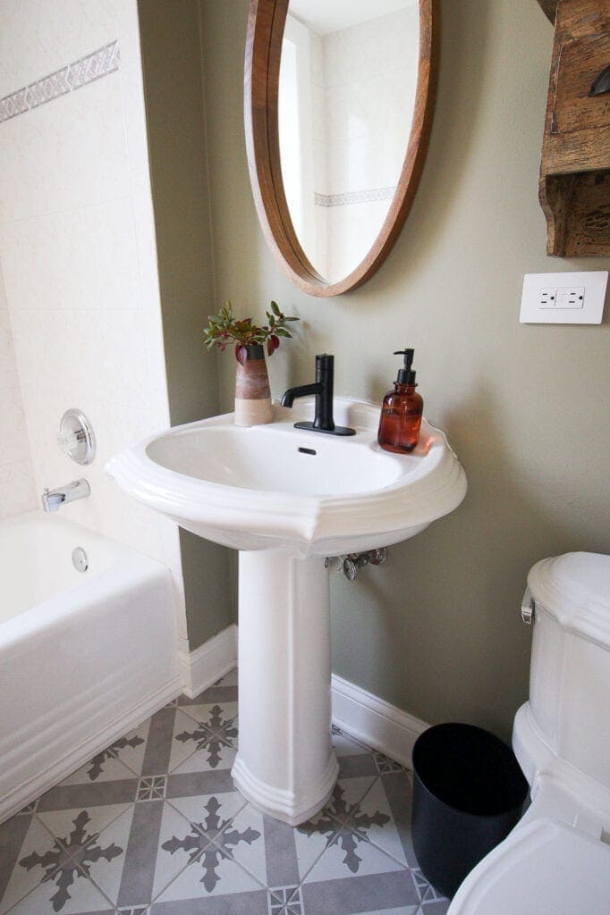 Old pedestal sink with new faucet