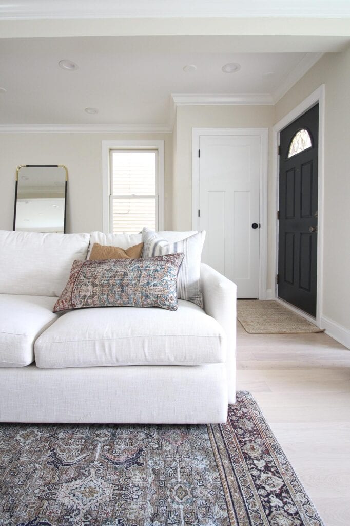 A neutral couch with linen looking fabric