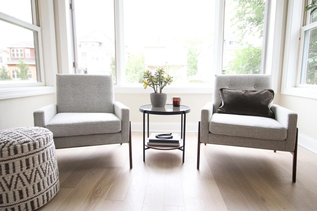 Two chairs in a window to add living room seating