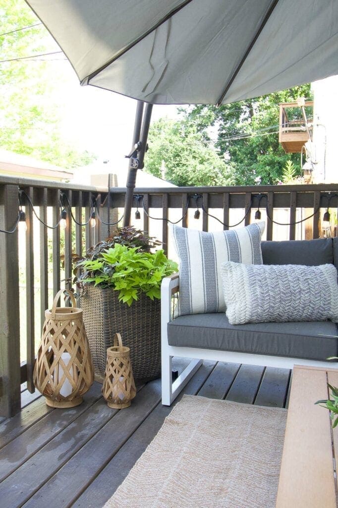 Outdoor planter and umbrella on this deck makeover