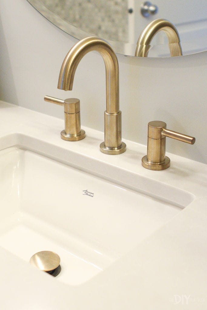 american standard sink and brass faucet