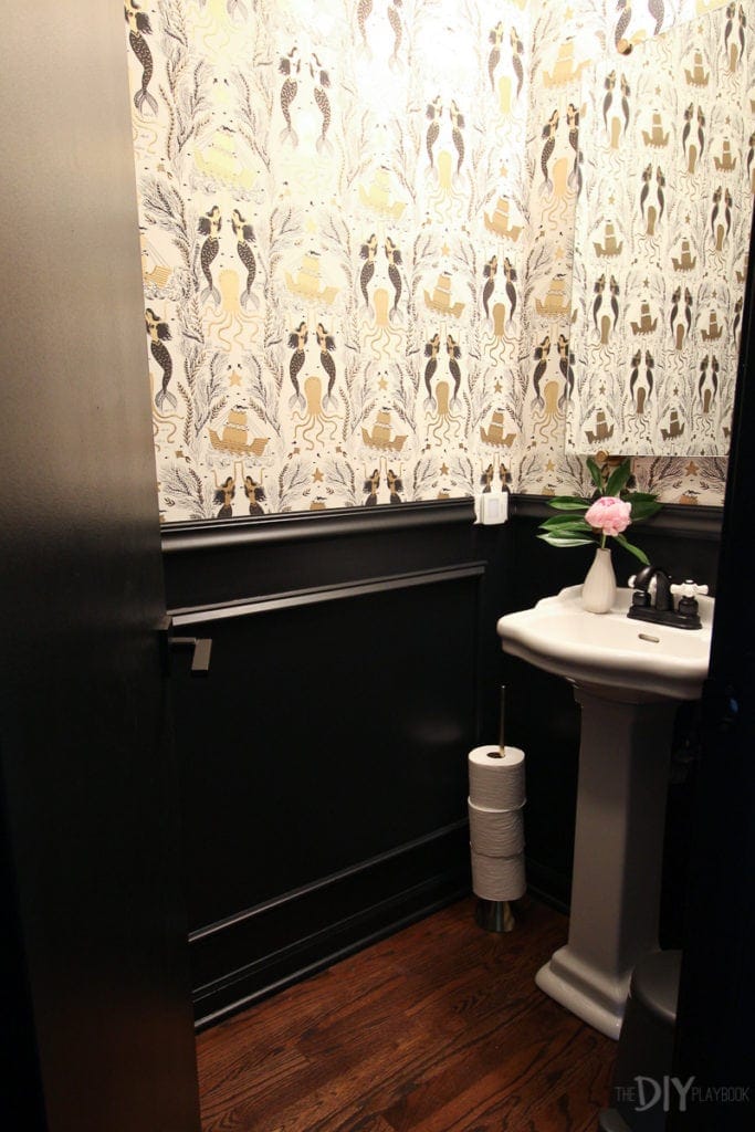 Powder room with wallpaper