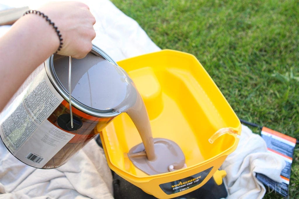 Pouring paint into a paint sprayer