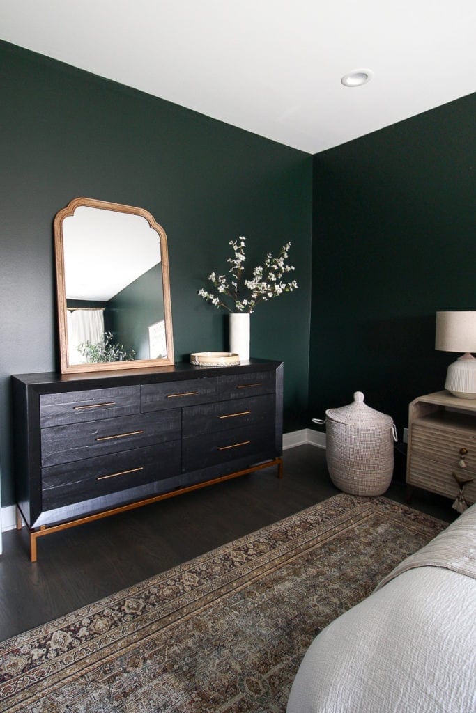 Black dresser and wood mirror