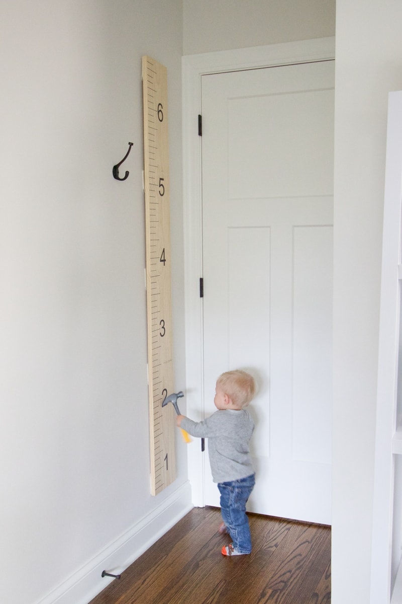 Ben measuring height with growth chart