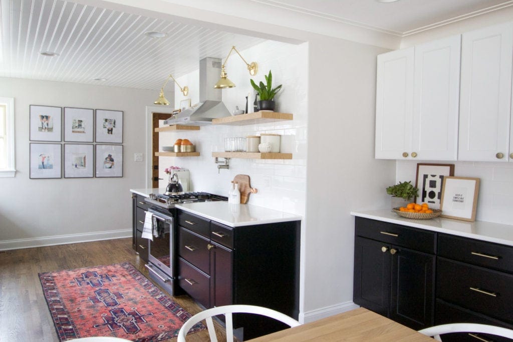 kitchen with black cabients and white uppers