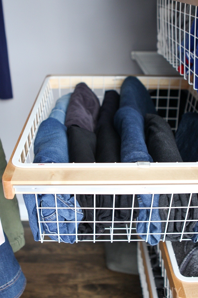 Storing jeans in a wire basket in the closet