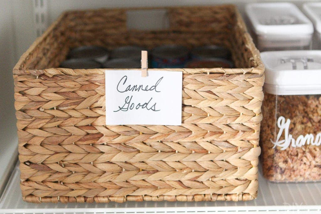 Use wicker baskets in a pantry to corral canned foods
