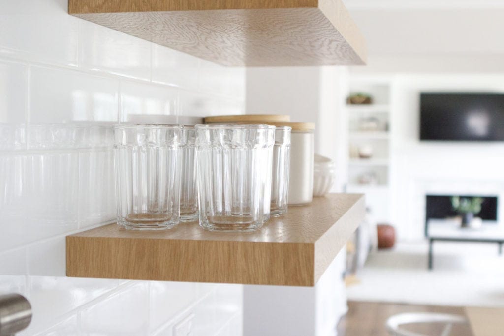 displaying glasses on kitchen open shelves