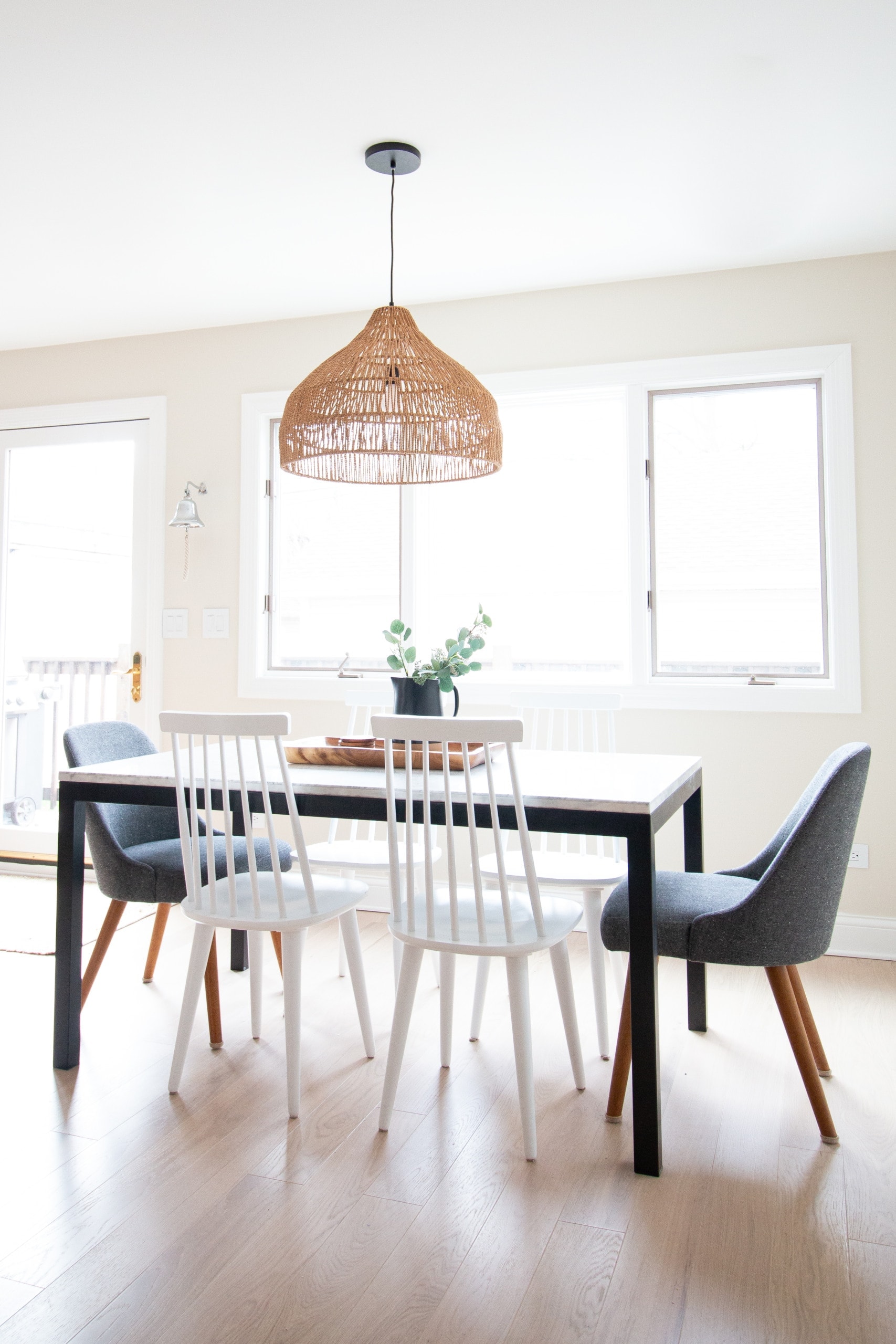 Dining room with woven light fixture