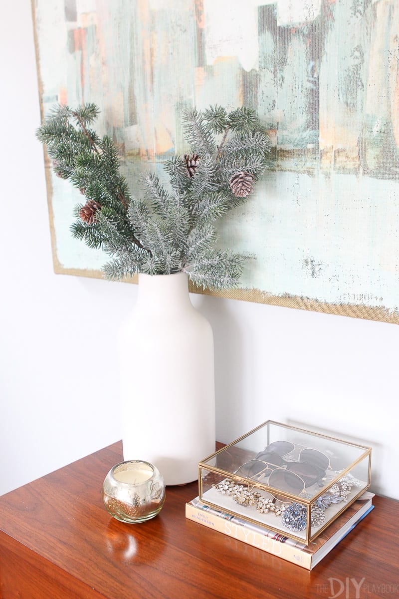 Use a tall white vase to hold holiday branches