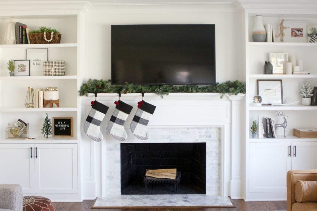 decorating a fireplace mantel for Christmas