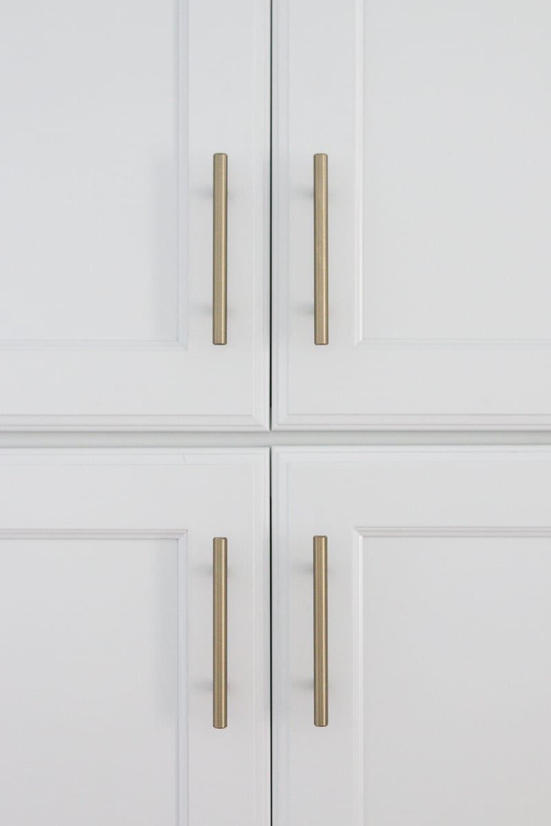 brass hardware on a white pantry