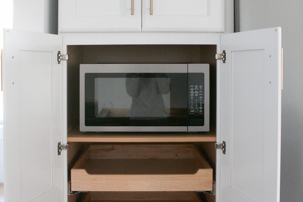 microwave inside of a pantry