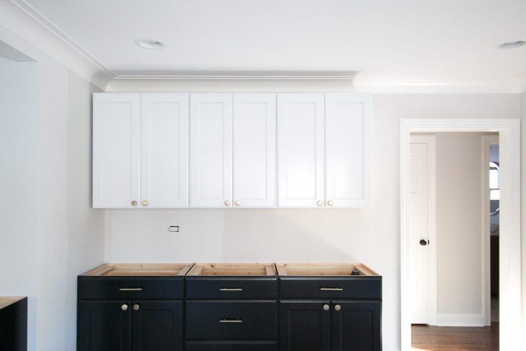 white upper cabinets and black lower cabinets from Lowes