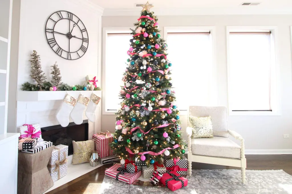 A colorful Christmas tree with pink and gold