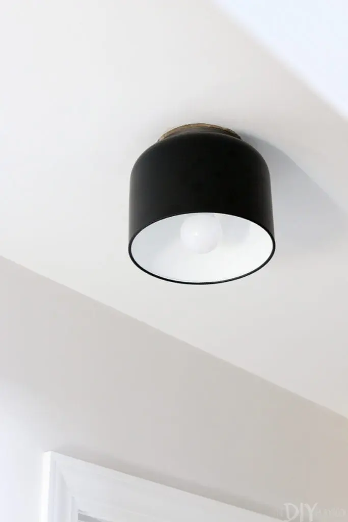 Add a semi-flush mount light fixture to the ceiling