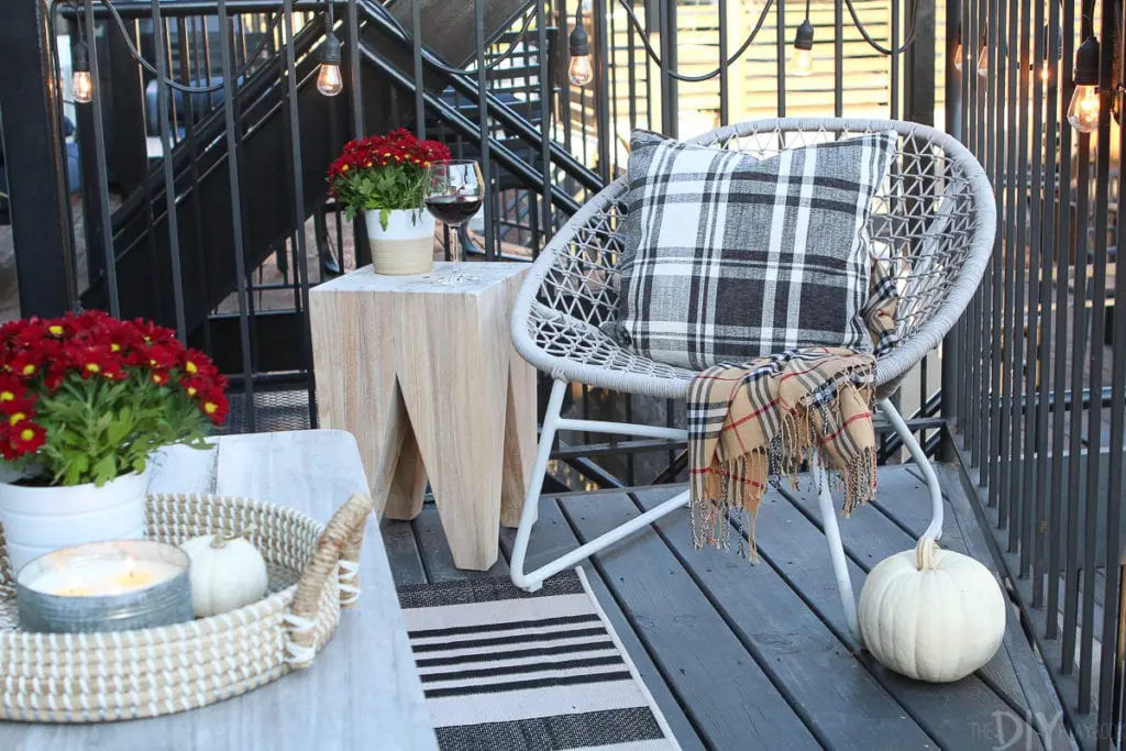 Adding plants and blankets to a fall patio
