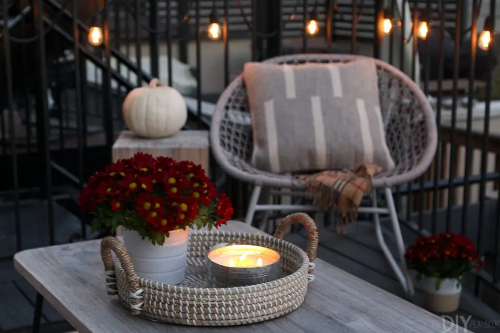 Light candles on your patio to keep bugs away and set the mood