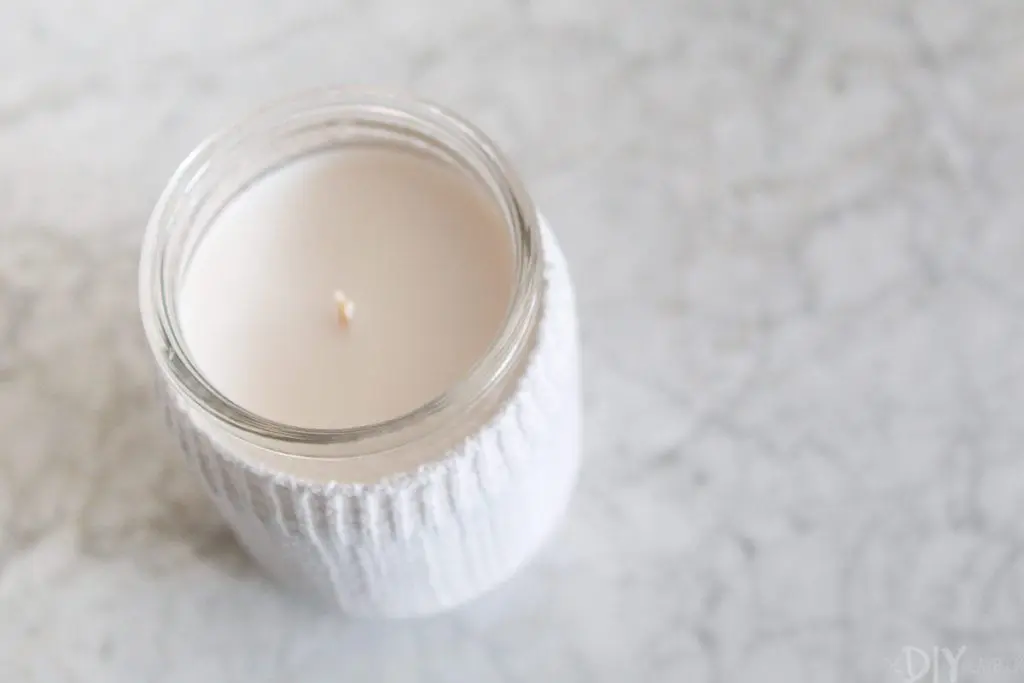 Cover an ugly candle with an old sock 