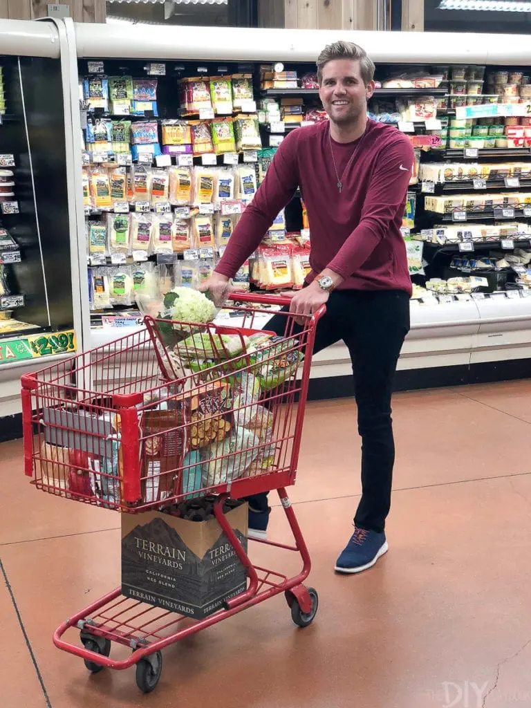 Finn pushing grocery cart at trader joe's