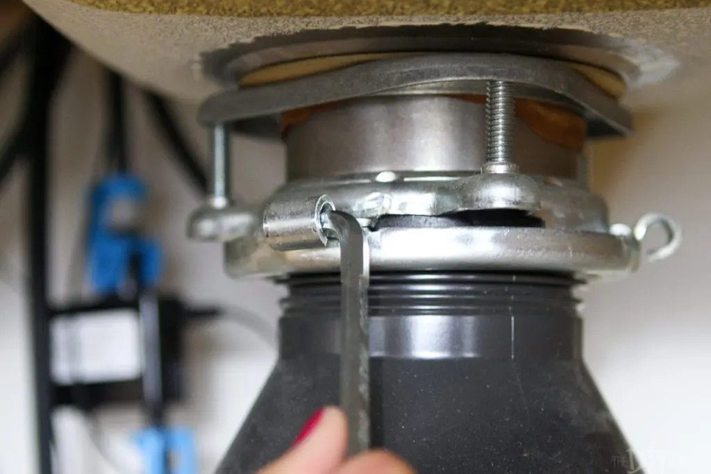 Use a wrenchette to remove old garbage disposal